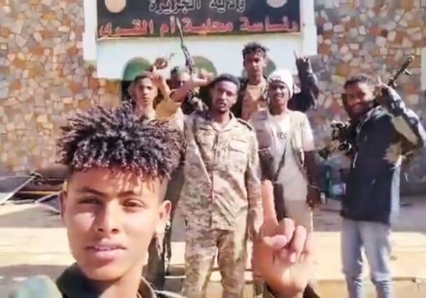 Sudanese arm and Keikl forces pose outside the Um al-Qura municipality on Jan 10, 2025