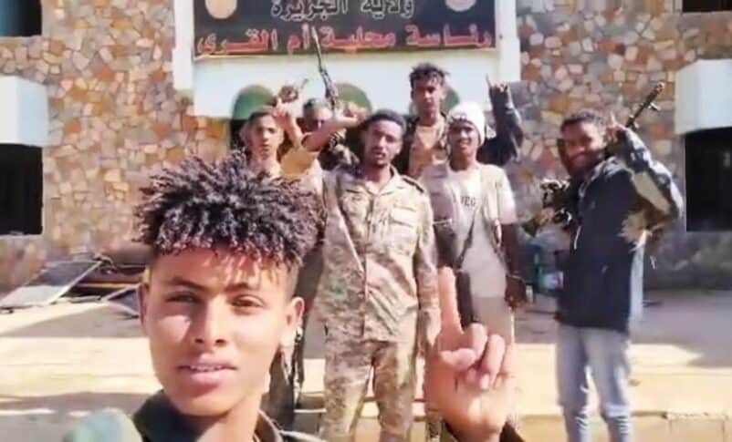 Sudanese arm and Keikl forces pose outside the Um al-Qura municipality on Jan 10, 2025