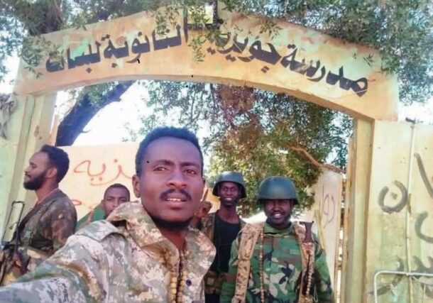 Sudanese army soldiers stand outside the Juwayriyah School south of Shambat, Bahri, on Jan 21, 2025