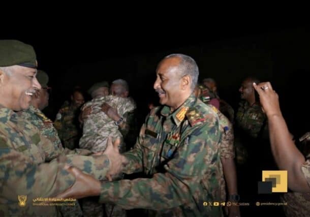 Sudan's army chief General Abdel Fattah al-Burhan (R) is greeted by a military officer at the army headquarters in Khartoum, Jan. 26, 2025.
