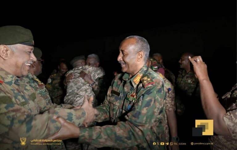 Sudan's army chief General Abdel Fattah al-Burhan (R) is greeted by a military officer at the army headquarters in Khartoum, Jan. 26, 2025.