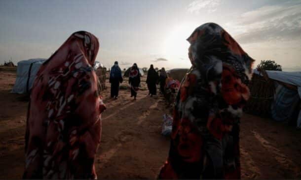 Survivors of sexual violence from the conflict in Geneina gather outside makeshift shelters in Adré Chad. Reuters file photo
