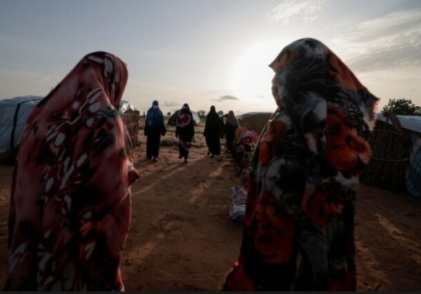 Survivors of sexual violence from the conflict in Geneina gather outside makeshift shelters in Adré Chad. Reuters file photo