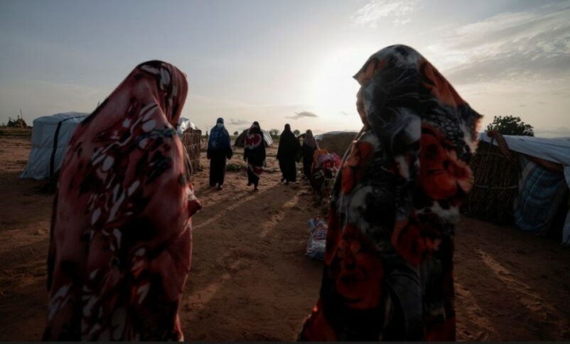 Survivors of sexual violence from the conflict in Geneina gather outside makeshift shelters in Adré Chad. Reuters file photo