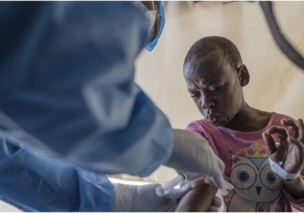 A health worker attends to a mpox patient, at a treatment centre in Munigi, eastern Congo, Monday, Aug. 19, 2024