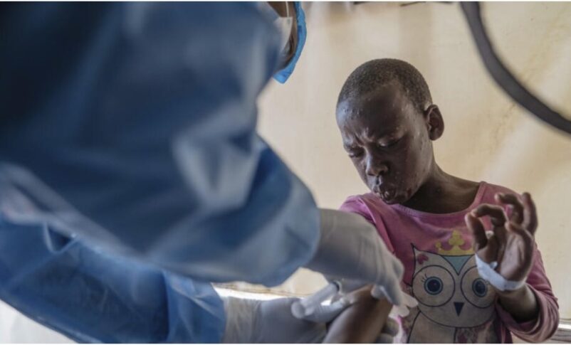 A health worker attends to a mpox patient, at a treatment centre in Munigi, eastern Congo, Monday, Aug. 19, 2024