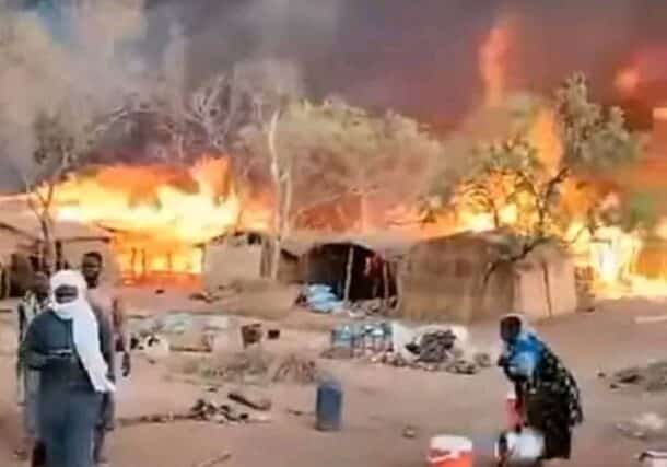 A woman flees the flames engulfing the Zamzam market on Feb 15, 2025