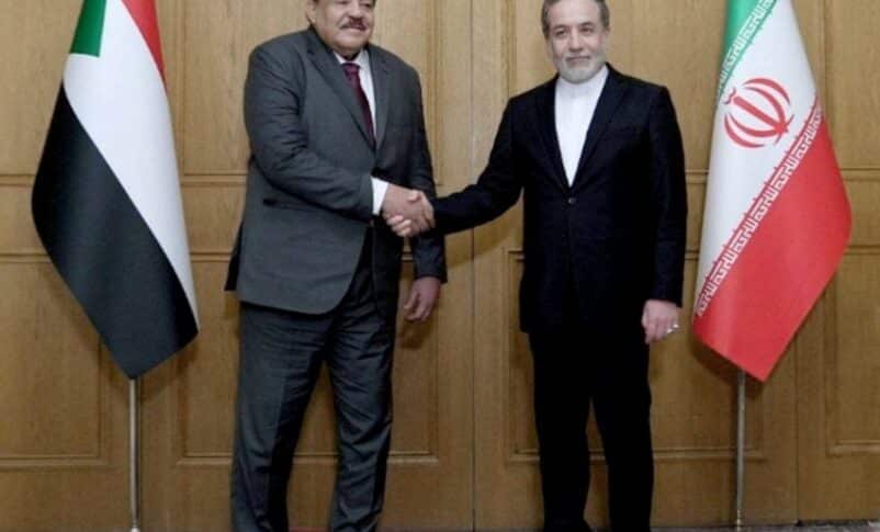 Sudan's FM Ali Youssif, shakes hands with Iranian counterpart Seyed Abbas Araghchi, in Tehran on Feb 18, 2025