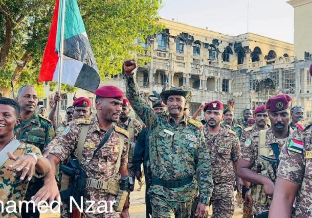 Al-Burhan raise hand inside the Republican Palace in Khartoum on March 26, 2025