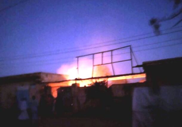 Flames engulf a house in El Obeid after it was struck by a long-range projectile fired by the RSF in the early morning of March 13, 2025.