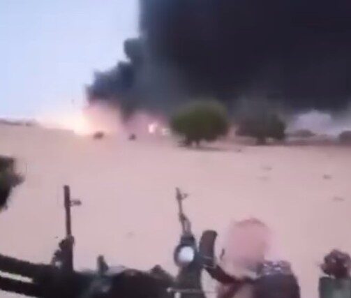 Members of the Joint Force watch an airstrike on RSF supply vehicles near El Fasher, Sudan, on Feb. 27, 2025