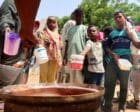 People hold pots as volunteers distribute food in Omdurman, Sudan, September 3, 2023. Reuters photo