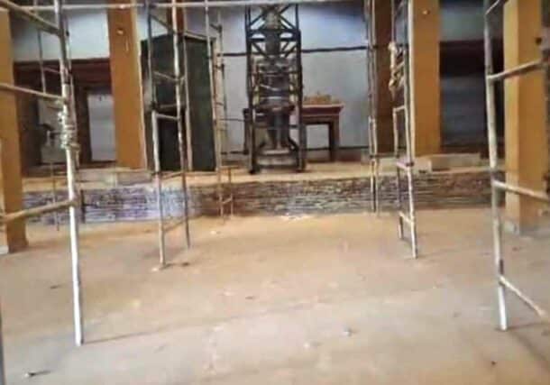 The statue of King Taharqa stands as the sole remaining piece in a hall stripped of its antiquities.