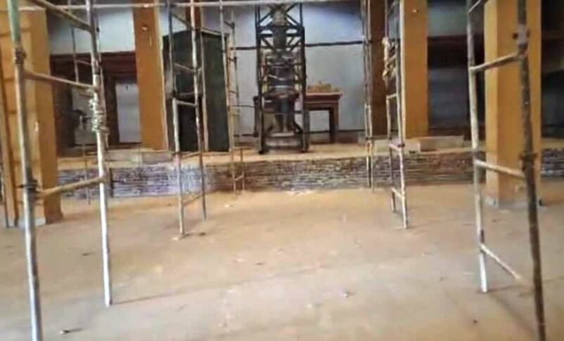 The statue of King Taharqa stands as the sole remaining piece in a hall stripped of its antiquities.