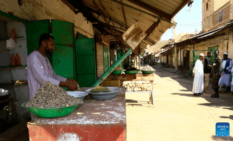 A trader is seen in the Grand Market of Omdurman, near Sudan's capital Khartoum, on November 13, 2024