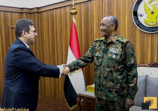 Al Burhn shakes hands with Egypt's General Intelligence chief, Hassan Mahmoud Rashad on April 8, 2025