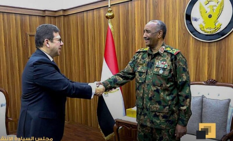 Al Burhn shakes hands with Egypt's General Intelligence chief, Hassan Mahmoud Rashad on April 8, 2025