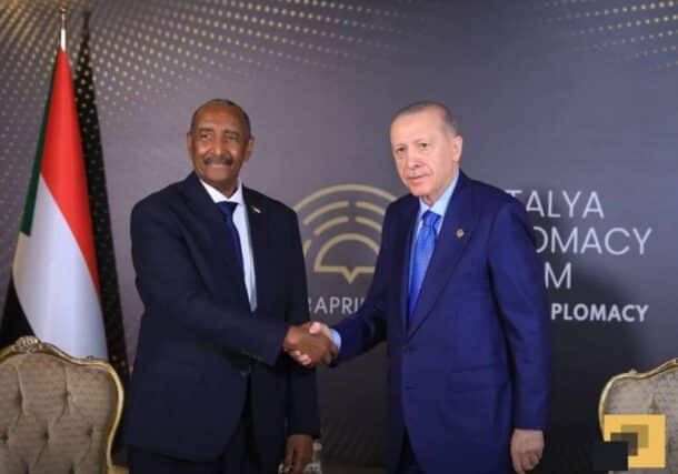 Burhan shakes hands with Erdogan on April 12, 2025