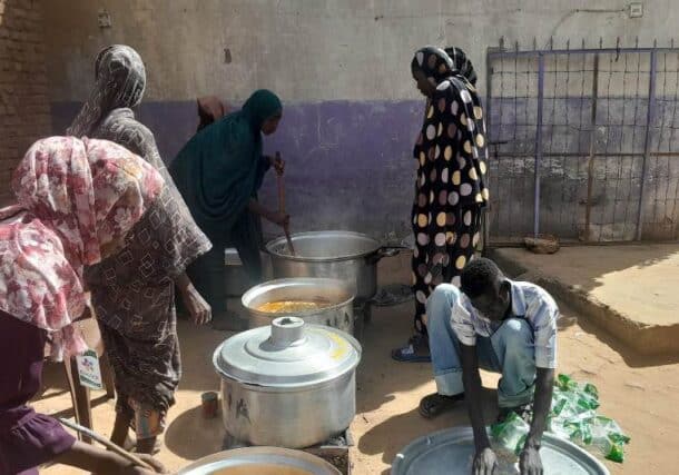 Members of a communal kitchen in El Fasher prepare a meal on October 22, 2024-1