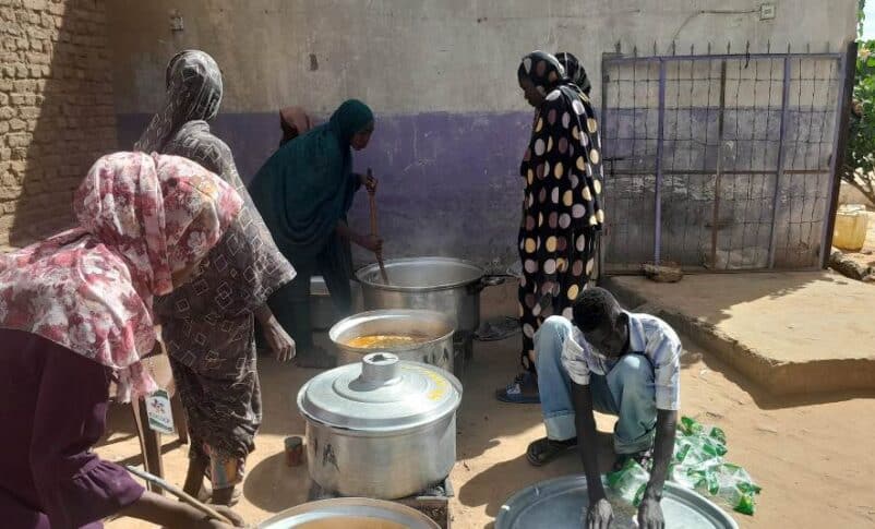 Members of a communal kitchen in El Fasher prepare a meal on October 22, 2024-1