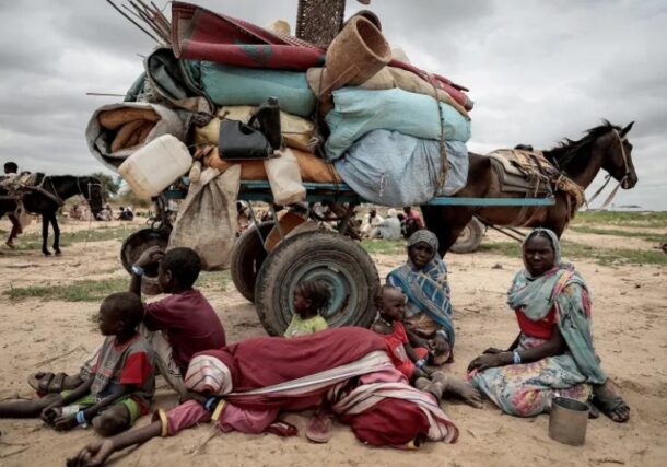 A Sudanese family that fled the conflict in the Darfur region wait to be registered by the UNHCR upon crossing the border into Chad, Reuters file photo