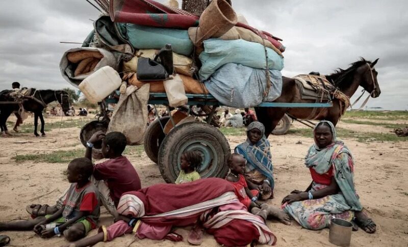 A Sudanese family that fled the conflict in the Darfur region wait to be registered by the UNHCR upon crossing the border into Chad, Reuters file photo