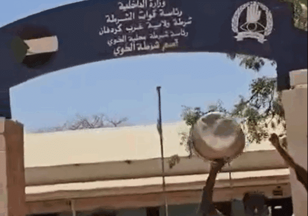 Civilians outside Al-Khuwayy police station welcome the Sudanese forces (unseen) on May 13, 2025