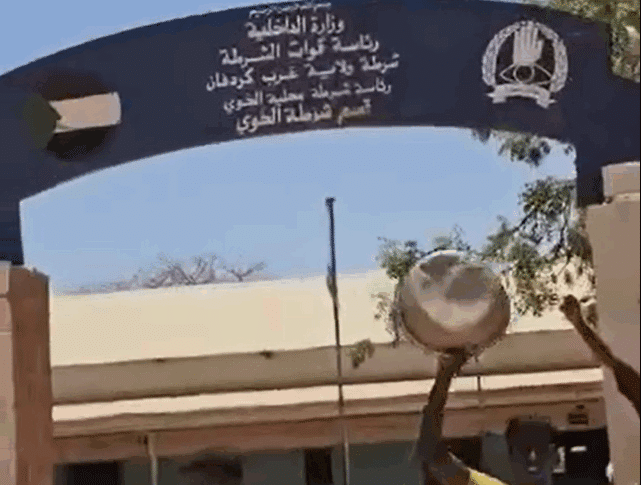 Civilians outside Al-Khuwayy police station welcome the Sudanese forces (unseen) on May 13, 2025