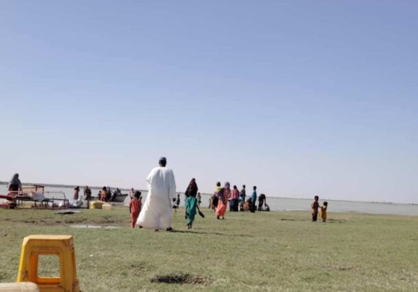 Displaced by RSF attacks, residents of West White Nile villages flee towards an island in the White Nile, on May 18, 2025