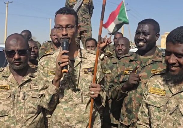 Al-Misbah Abu Zaid, leader of the Al-Baraa bin Malik, Islamist militia group speaks to his fighters heading to western Sudan on May 5, 2025