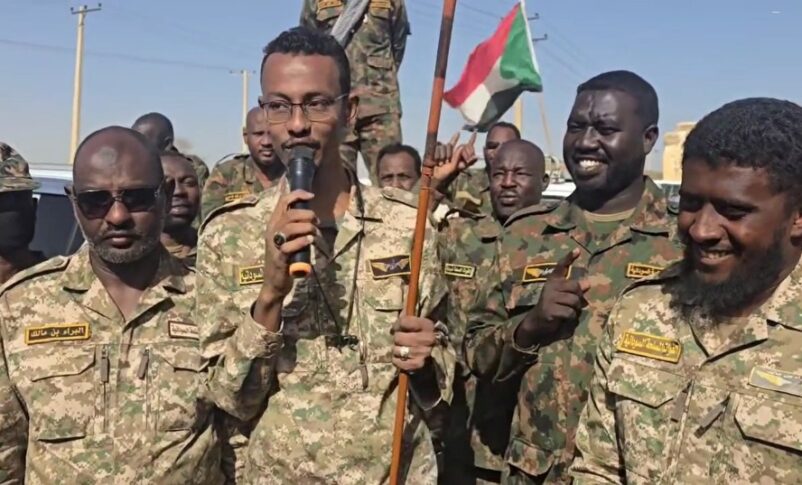 Al-Misbah Abu Zaid, leader of the Al-Baraa bin Malik, Islamist militia group speaks to his fighters heading to western Sudan on May 5, 2025