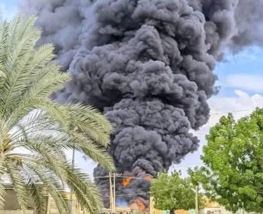 Smoke billows from a fuel depot in Kosti's industrial area after a drone strike on May 27, 2025.