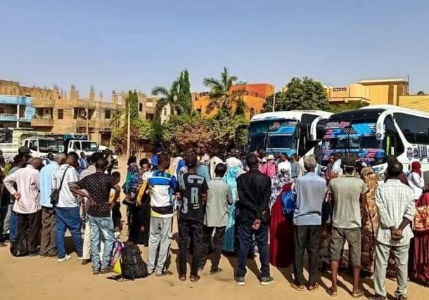 The first group of refugees gather in Khartoum on May 29, 2025, ahead of their repatriation.