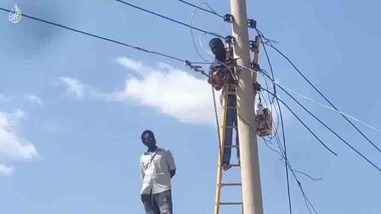 Volunteers work to restore electricity by repairing damaged power lines in Khartoum Bahri, AlKhoujalab photo