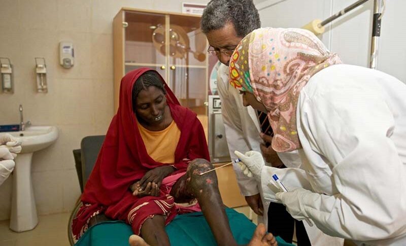 A file photo shows doctors examining a patient infected with mycetoma.