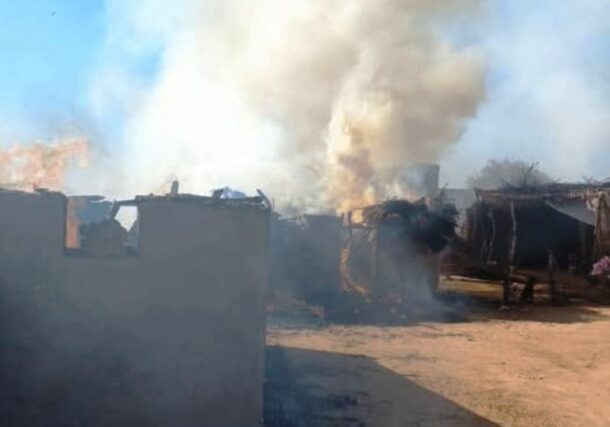 File photo of houses burning in Al-Koma, North Darfur, after a Sudanese army air strike, Dec. 11, 2024. The town, controlled by the Rapid Support Forces, has been repeatedly targeted.