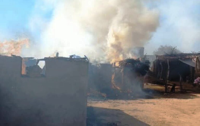 File photo of houses burning in Al-Koma, North Darfur, after a Sudanese army air strike, Dec. 11, 2024. The town, controlled by the Rapid Support Forces, has been repeatedly targeted.