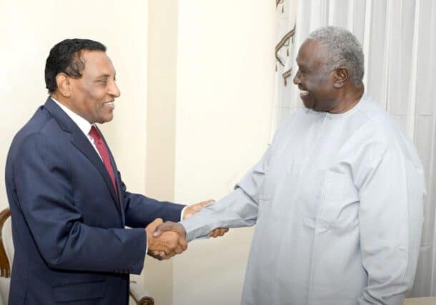 Malik Agar, Sovereign Council deputy chairman shacks hands with Prime Minister Kamil Idris on June 3, 2025