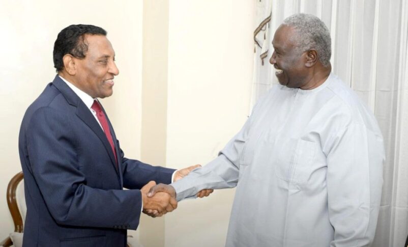 Malik Agar, Sovereign Council deputy chairman shacks hands with Prime Minister Kamil Idris on June 3, 2025