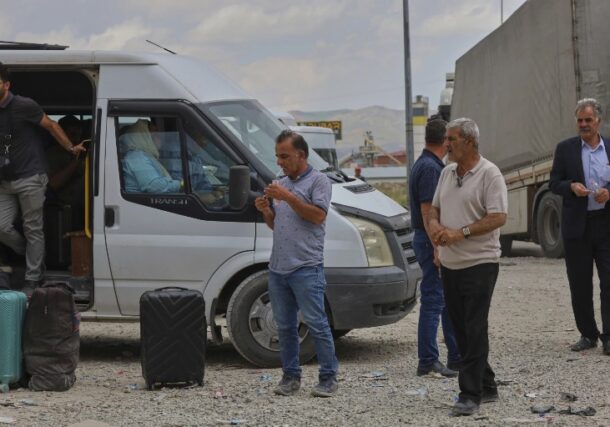 People wait after crossing from Iran into Turkey at Gurbulak Bazargan border post, in Gurbulak, Turkey, Monday, June 16, 2025, AP Photo