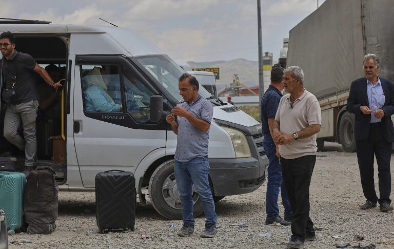 People wait after crossing from Iran into Turkey at Gurbulak Bazargan border post, in Gurbulak, Turkey, Monday, June 16, 2025, AP Photo