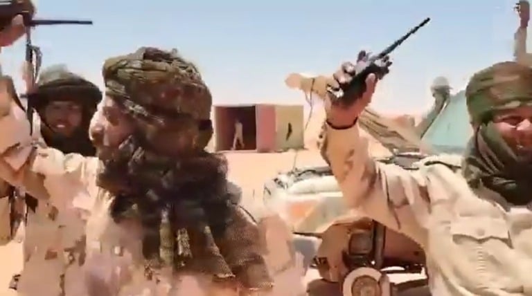 RSF elements celebrate the capture of the Karb al-Toum located near the Jebel Arkenu mountain range in the Northern State, on June 16, 2025