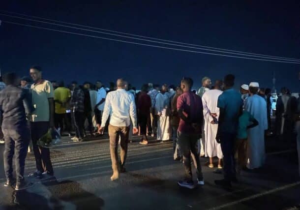 Wadi Halfa residents gather outside the electricity offices to protest the start of scheduled power cuts on June 1, 2025