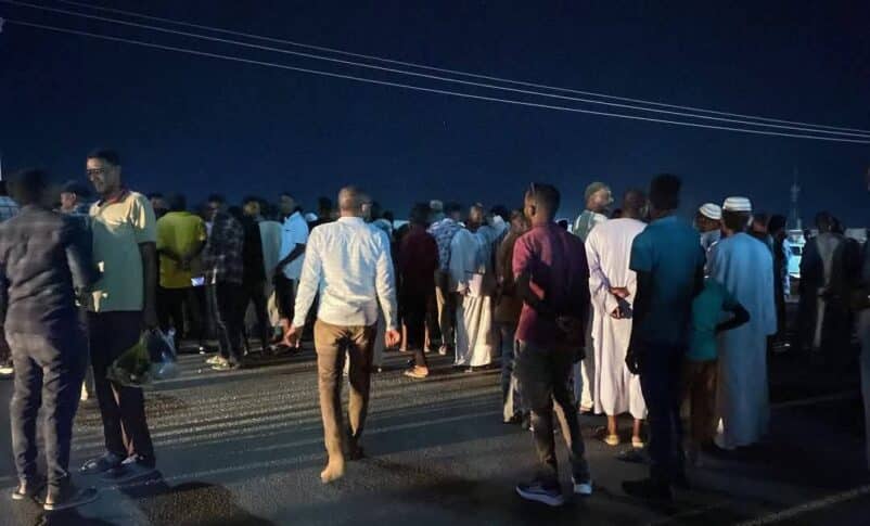 Wadi Halfa residents gather outside the electricity offices to protest the start of scheduled power cuts on June 1, 2025