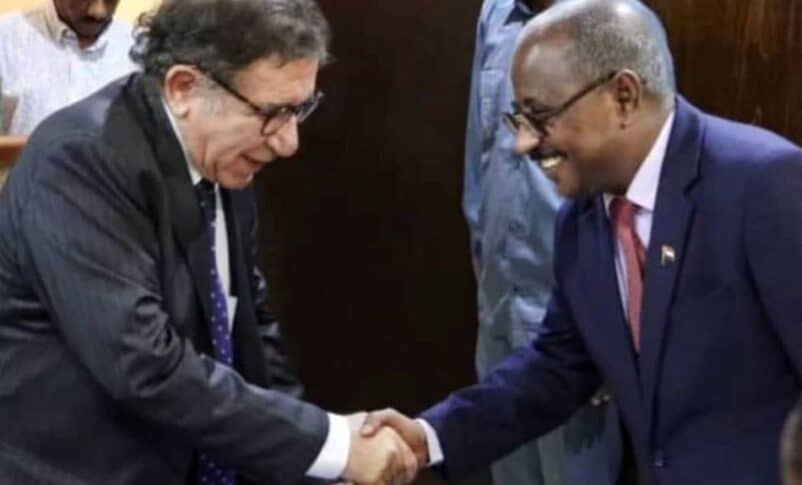 Abdullah Diraf, Sudan's Minister of Justice, greets Radhouane Nouicer, the U.N. Independent Expert, ahead of their meeting in Port Sudan on July 28, 2025.