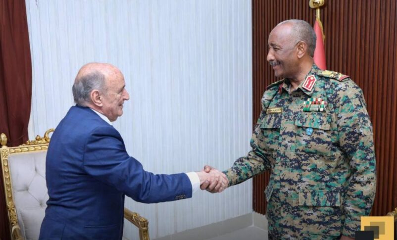 General Abdel Fattah al-Burhan, head of Sudan's Sovereignty Council, greets African Union envoy Mohamed Belaiche in Port Sudan on July 29, 2025.