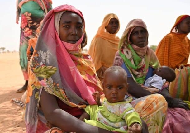 Hadjie Al Nour Sar (left) with her daughter Fatima at the Aboutengue refugee camp in eastern Chad. UNHCR photo