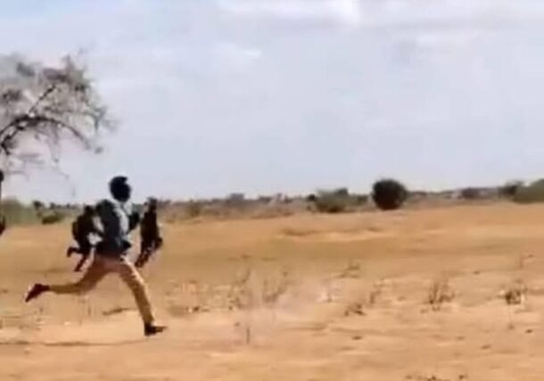RSF fighters flee the Joint Force troops (unseen) outside Um Sumaima, North Darfur, on July 13, 2025
