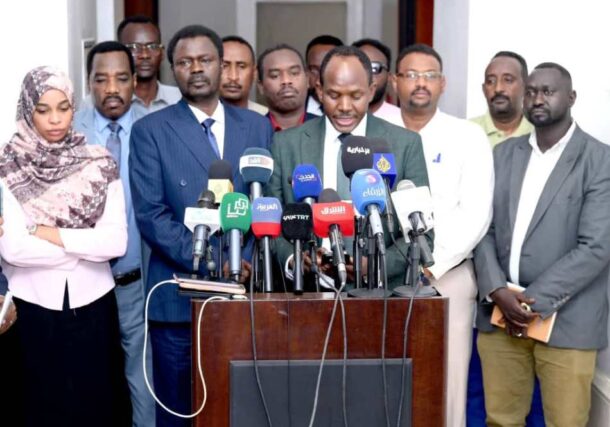 SLM leader Minni Minawi (L) and Mohamed Zakaria JEM spokesman speak to the press in Port Sudan on July 13, 2025