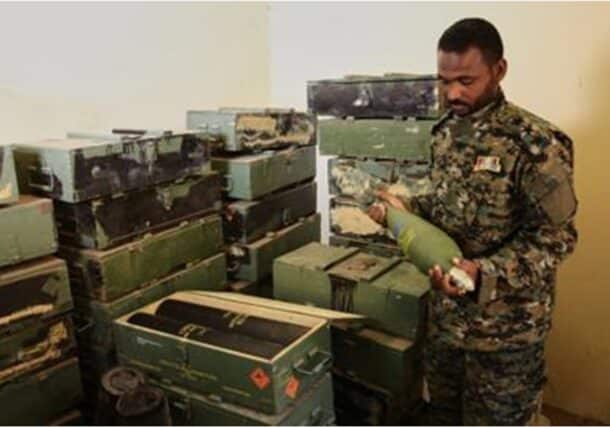 Sudanese army officer inspects a discovered weapons storage site belonging to the (RSF in Khartoum on May 3, 2025, AP Photo